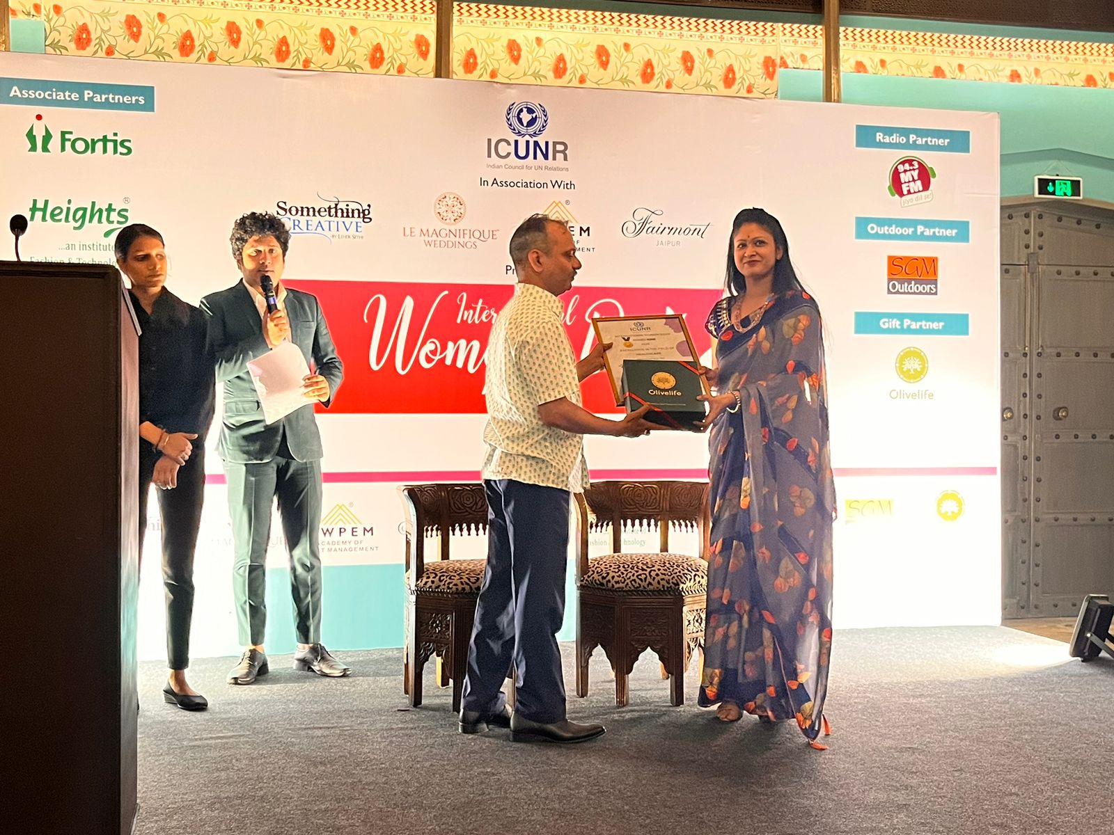 Dr. Shanoo Agarwal receiving award at International Women's Day event – ICUNR, Fairmont Jaipur